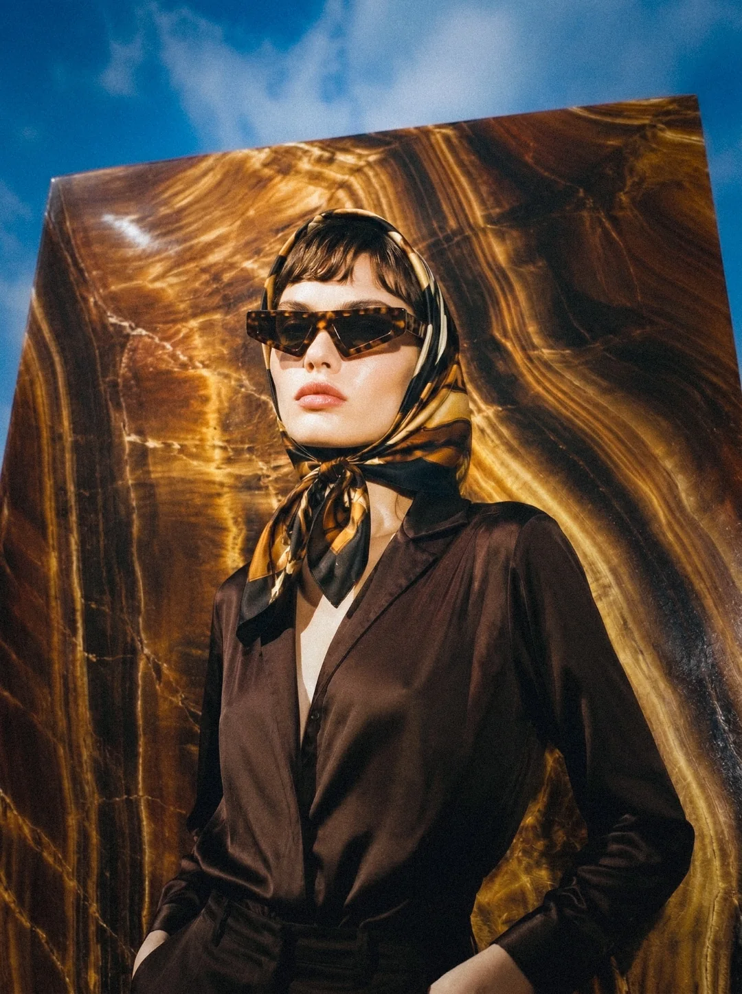 AI fashion campaign visual: close portrait wearing tortoiseshell sunglasses